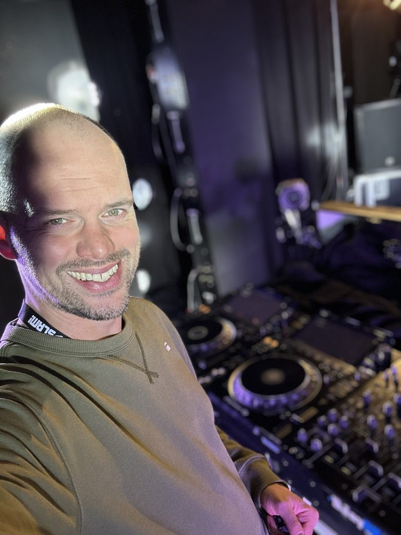 Anton smiling behind the decks